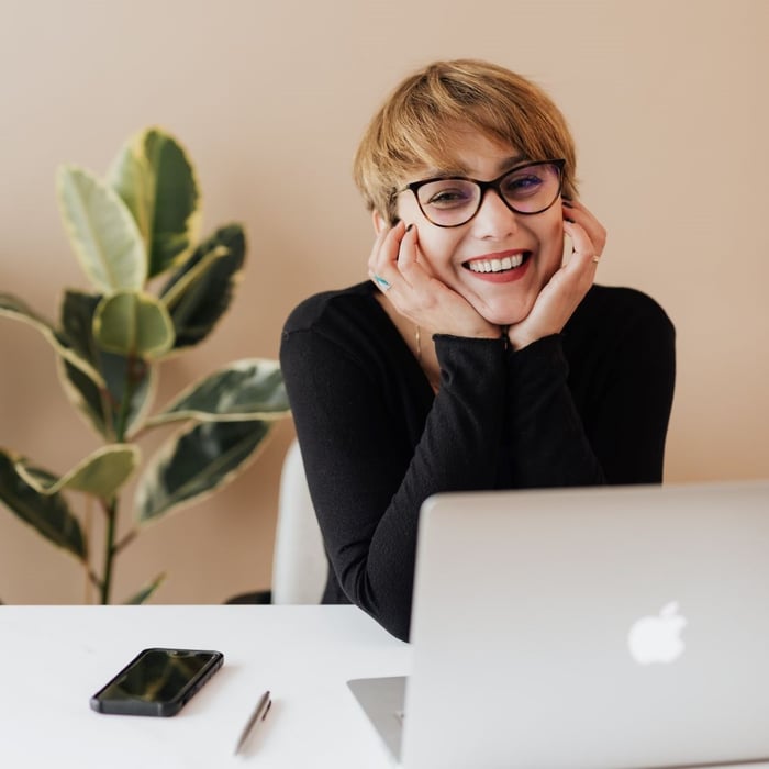 Woman-with-laptop-smiling-square