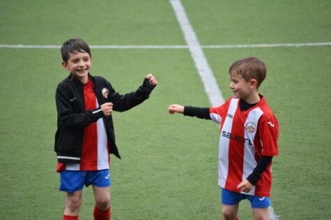 Kids playing soccer as a result of the vouchers program